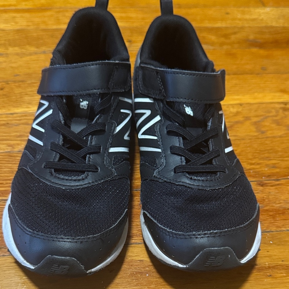 Gently worn boys New Balance Kids' Black and White Sneakers